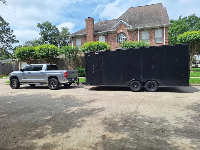 Large professional junk removal trailer in Spring TX showing full-service alternative to dumpster rental