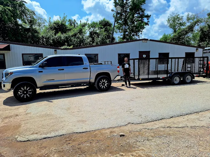 Professional moving truck and trailer with equipment for The Woodlands Texas local moves